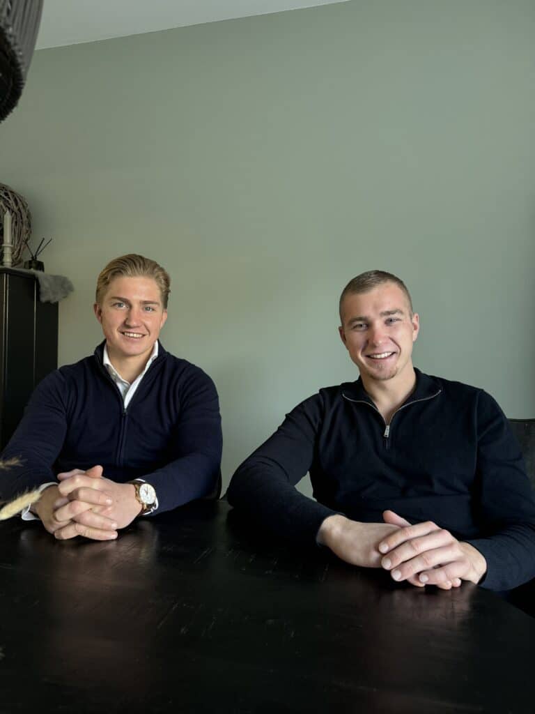 two men sitting at a table